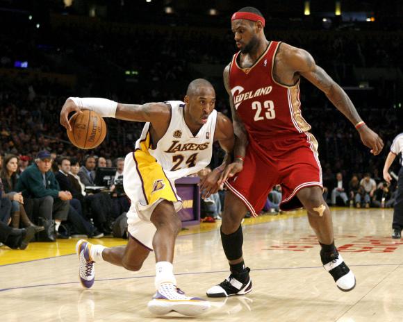 LeBron in Nike LeBron V White/Black/Crimson guards Kobe in Nike Zoom Kobe III "Home"