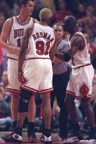 Luc Longley wearing Air Jordan 12s